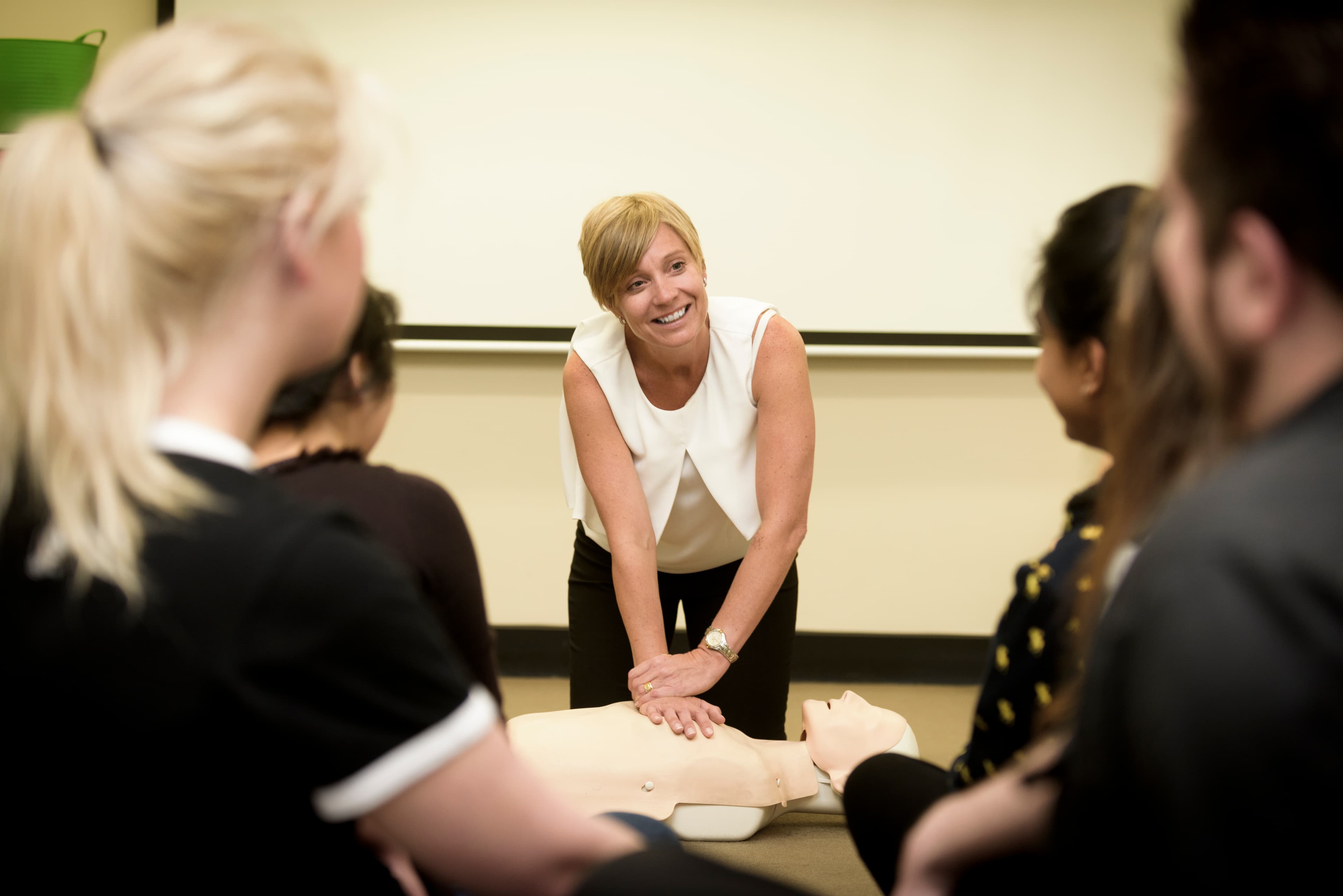 First aid instructor demonstrating CPR in Canberra